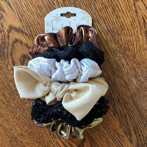 Nicole Miller set of 6 hair scrunchies. Neutral colors and black.